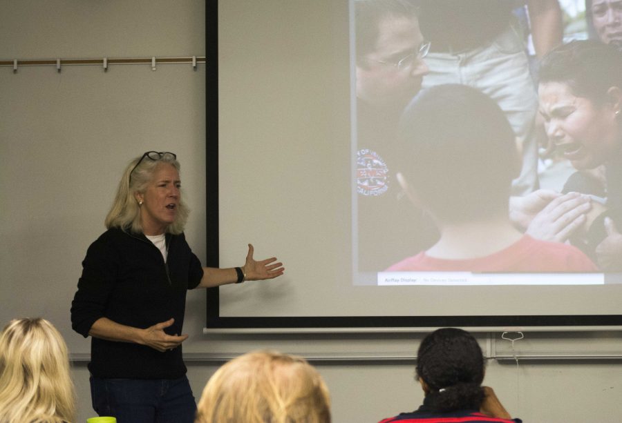 Karen Quincy Loberg, Moorpark Colleges new photojournalism professor, explains one of her own images to the Intro to Basic Photojournalism class. Photo credit: Gabrielle Biasi