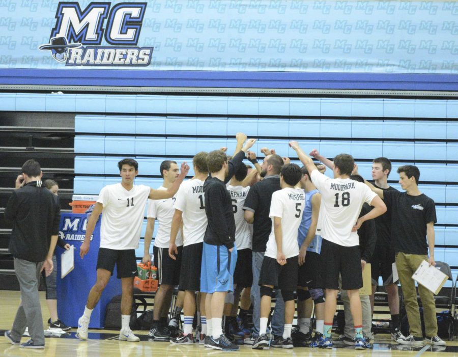 Moorpark College Raiders Mens Volleyball team playing Palomar College at Moorpark College on Wednesday, February 17, 2016 in Moorpark, California.  The MC Raiders gather in a huddle and raise their fists in unity after a short collaboration.  They return to the floor to beat Palomar College 25 to 20. Photo credit: Lonnie Estrella