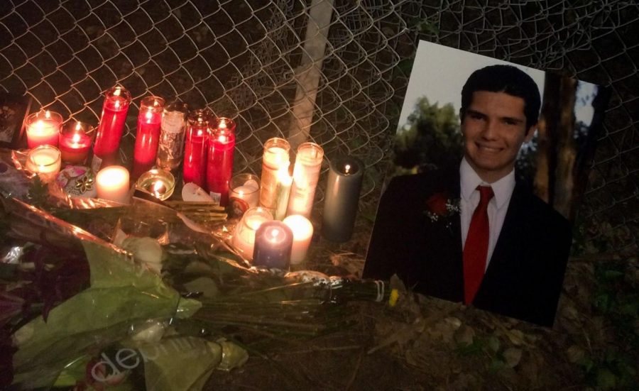 Cody+Hoffmans+impromptu+memorial+site+is+decorated+with+candles+and+flowers+on+March+29.+Hoffman+was+killed+in+a+car+crash+on+Monday+on+his+way+to+class.+Photo+credit%3A+Jessica+Frantzides