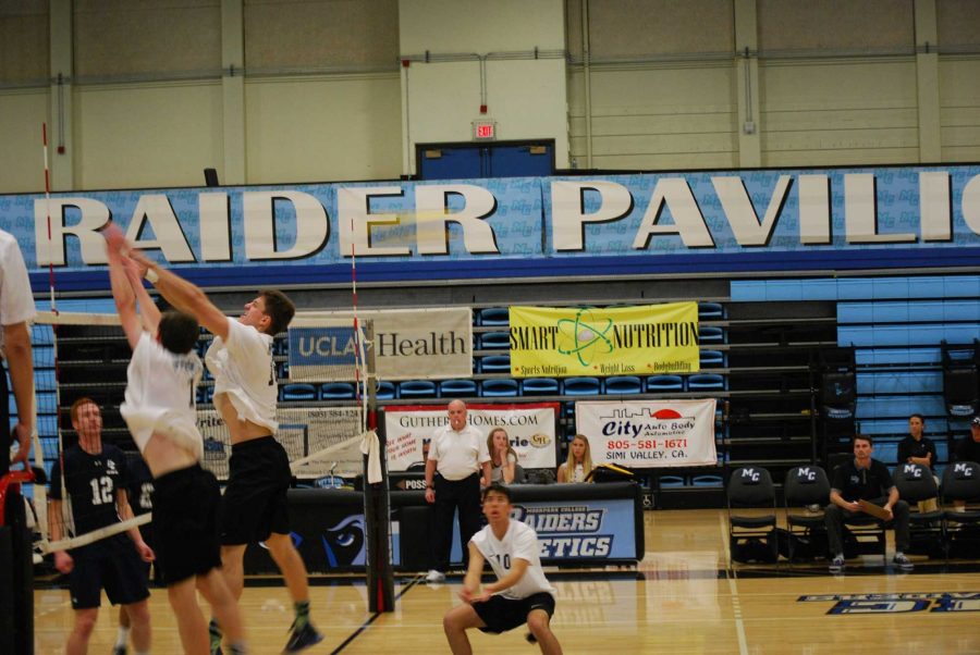 Ryan Butterworth, 7 (left) and Myles Myers, 18 (right) go up at the net for a block against El Camino. Butterworth had two back to back match winning serves. Photo credit: Spencer White