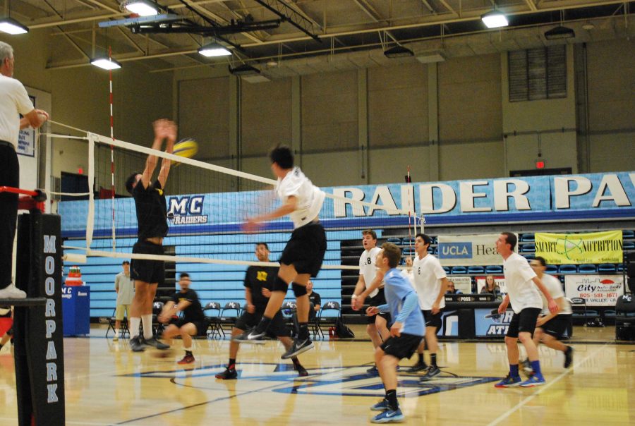 Vincent Urquidez, No. 5, goes up high for a kill against LA Trade Tech as his teammates look on. Photo credit: Spencer White