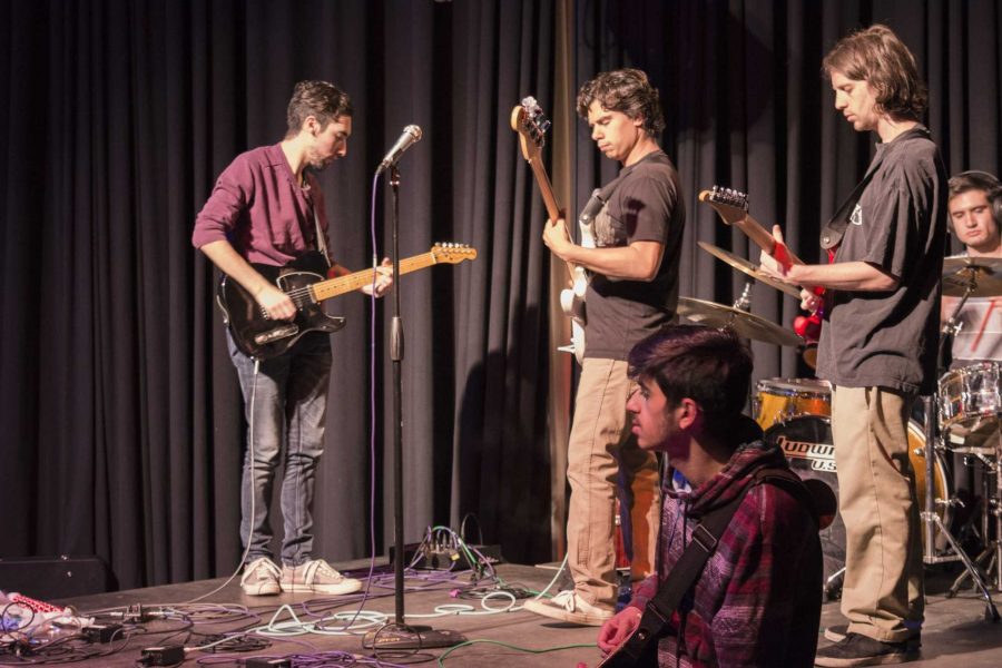 Student musicians sound check in preparation for Club M Improv on May 3 in COMM 129. Photo credit: Lonnie Estrella