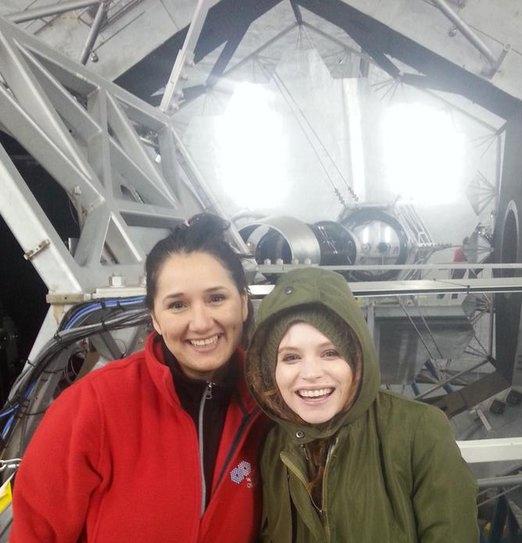 Professor Farisa Morales and Sandy Moak, astrophysics major, in front of the Keck telescopes ten-meter mirror.  Photo credit Justin Bracks.