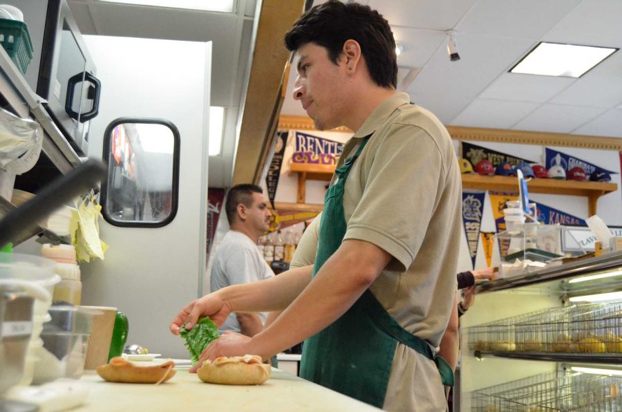 Gustavo Hernandez, 22, preparing a turkey sandwich that is serve on a bagel for a customer on March 30. He is an employee at East Coast Bagels in Westlake Village, where all of their sandwiches are served on bagels. People line up every day for their New York style bagels, breakfast and deli sandwiches.