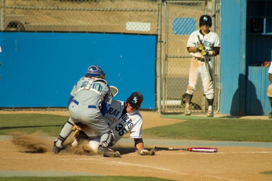 Dalton Duarte, #35, of Moorpark College is tag out as he slides into home in the bottom of the seventh inning in a home game against Oxnard April 21. Moorpark won 11-4.