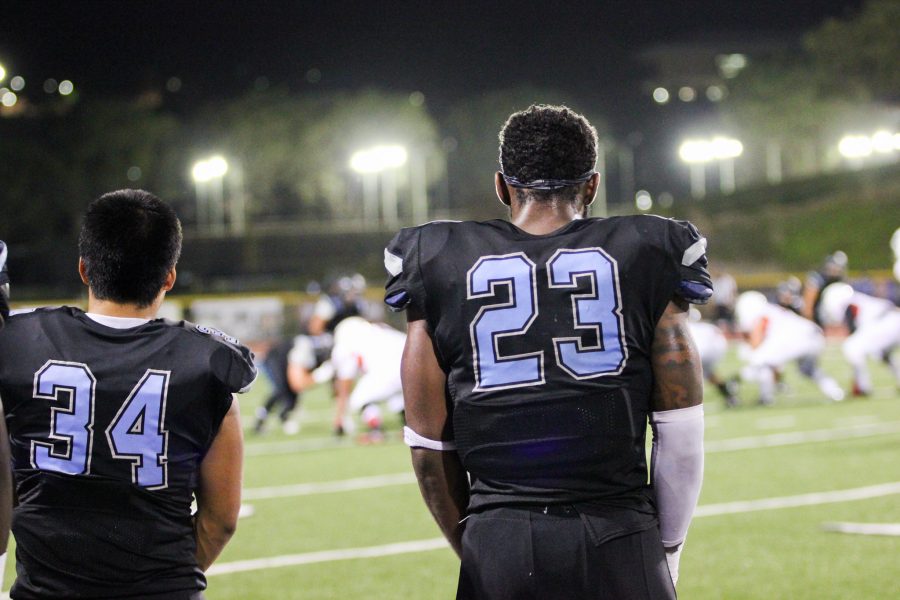 Moorpark College running backs River Meza and Isaiah Johnson look on as the Long Beach City College Vikings drive down the field in the third quarter of the Sept 17 game at the Moorpark College Raider Stadium. Photo credit: Scott Geirman