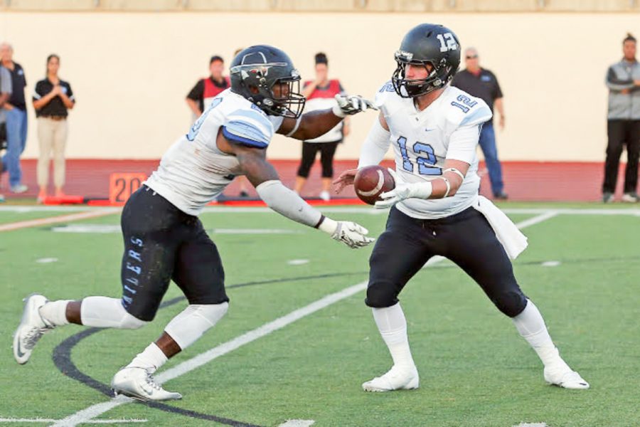 Moorpark College running back, Isaiah Johnson takes the hand-off from quarterback Trenton Thornton.  Finishing with three touchdowns and 162 yards on the ground, Johnson led this Raider team to a win at Palomar College. Photo credit: Hugh Cox