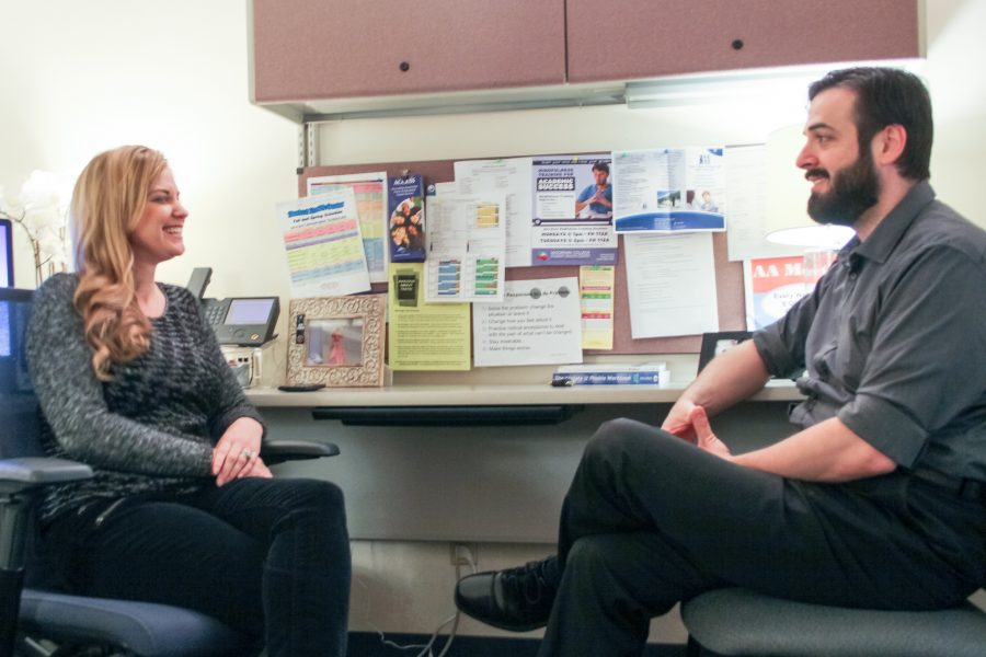 Audrey Miller and Robert Marzio talk in Millers office at the Health Center. Miller and Marzio are two of the three postdocs working at the Moorpark Health Center this semester. Photo credit: Elliott Keegan