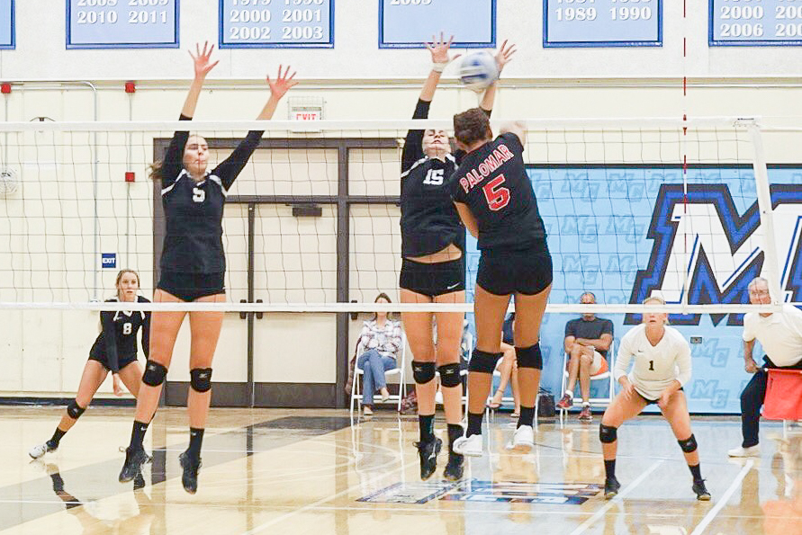 Moorpark+College+sophomores+Taylor+Brown+and+Meghan+Conlan+rise+up+to+block+the+spike+of+Kianna+Niu+of+Palomar+College+in+the+Sept.+16+home-match+at+the+Raider+Pavilion.+Photo+credit%3A+T.+Arnell+%28%40MC_Raiders+on+Twitter%29