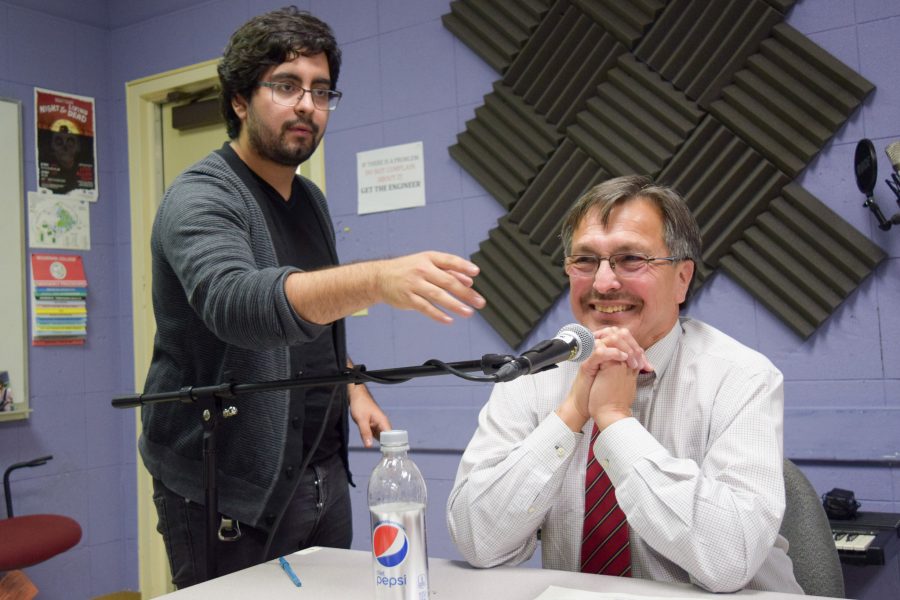 Moorpark College President Luis Sanchez, right, smiles as sound engineer Raul Perez adjusts the microphone. Sanchez discussed Proposition 51 with the StudentVoiceOnAir crew in the recording studio on Nov. 1. Photo credit: Son Ly