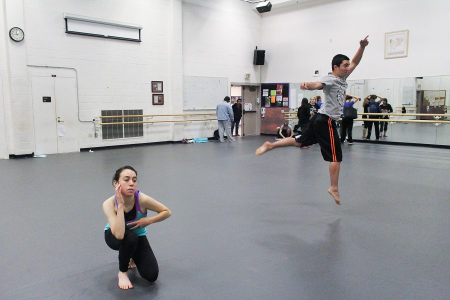 Hannah Rios, 21, liberal studies and education major, left, and Jared Cardiel, 19, Dance major practice their separate parts for Speaking Movement to be premiered on Nov. 17. Photo credit: Casey Ahern