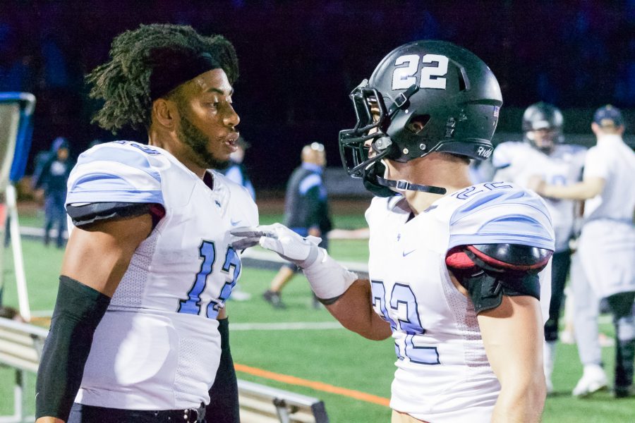 Raider wide receiver Corbin Covey (right) goes over over the game plan with quarterback Kado Brown during Saturdays away game at Ventura College.  Moorpark lost this one by a score of 42-28.