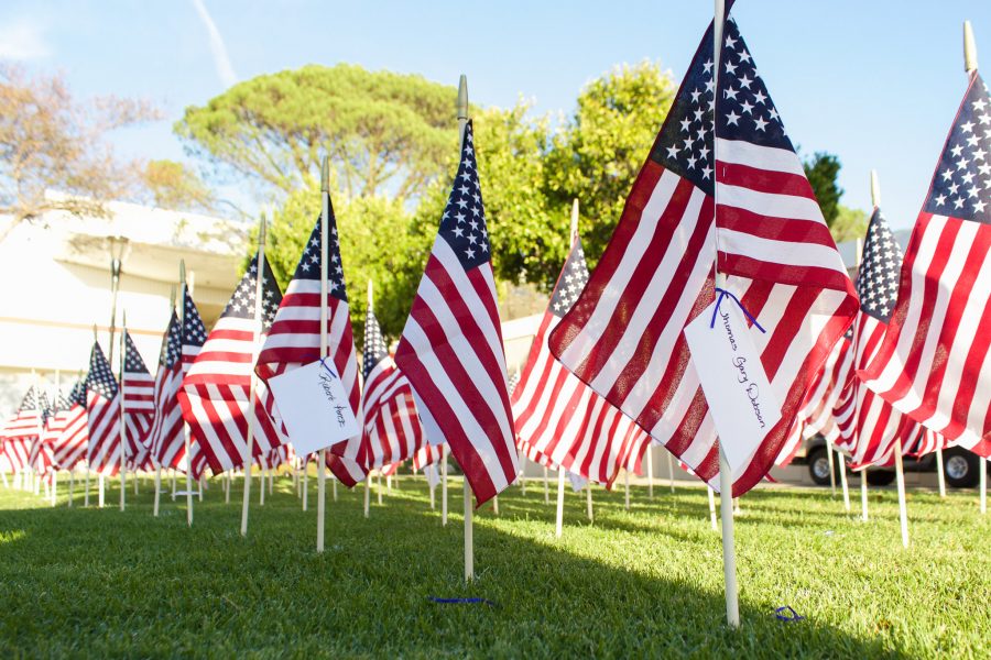 Flags stand outside of the Veterans Resource center a day before Veterans Day. As part of Moorpark Colleges Veterans Day ceremonies, students and faculty were encouraged to place small flags in the ground with the names of veterans passed or alive that are a part of their lives. Photo credit: Nathan Espinosa