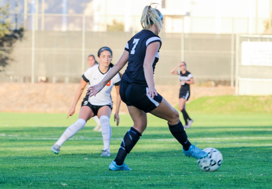 Raider freshman Haley Wargo passes the ball while being covered by a Pirate defender during Sundays game on the Raider Field. Moorpark won 2-0 against Ventura to claim a second consecutive WSC North title. Photo credit: Mathew Miranda