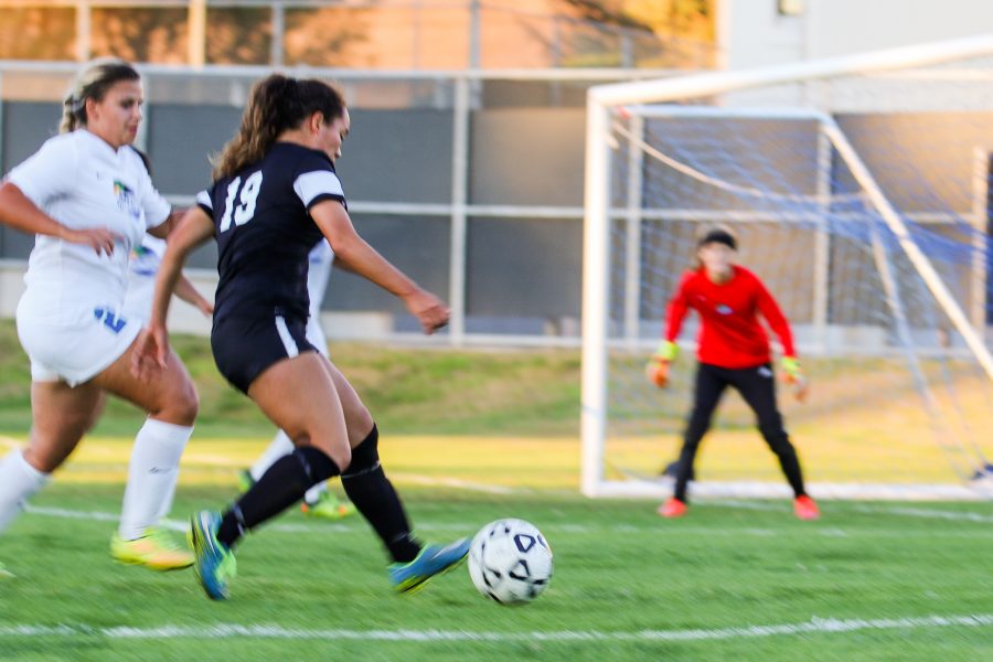 Raider+midfielder+Eva+Madarang+rushes+past+a+Oxnard+defender+looking+to+score+in+the+Friday+game+against+Oxnard+College+at+the+Raider+Field%2C+Oct.+28.+Photo+credit%3A+Mathew+Miranda