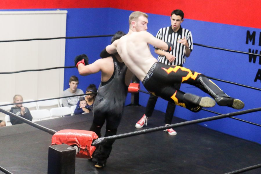 Moorpark College student Danny Cleary, 24, known as Danny Divine in the ring, grabs the neck of opponent Jugo Kong to bring him to the ground. Divine went on to win Round 2 of the Millenium Pro Wrestling National Championship Tournament on Fri. Dec. 9 in MPWs Moorpark arena.