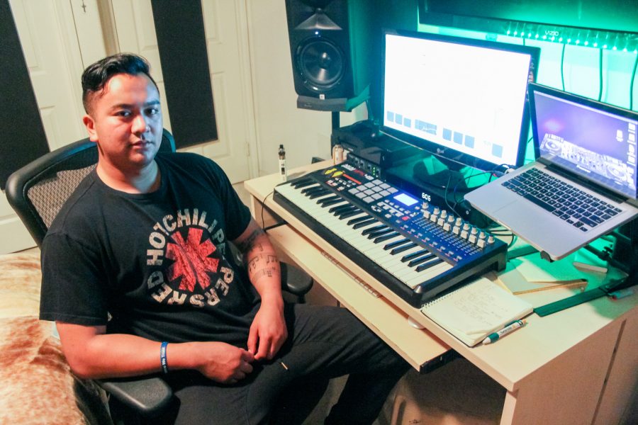 Jeff Jesalva, 25, sits in front of his home studio where he produces all of his music electronically. Jesalva is a former Moorpark College student and an aspiring DJ. Photo credit: Misha Goetze