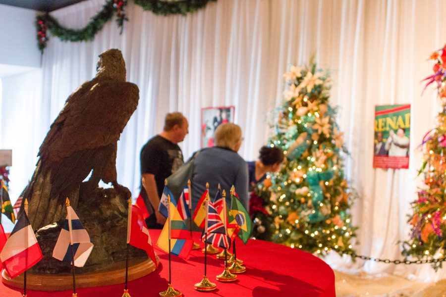 A family explores the Ronald Reagan Librarys Christmas Around the World exhibit. The display features Christmas tree decorations inspired by countries around the world that Reagan visited while in office, and is one of many holiday activities available to Los Angeles residents. Photo credit: Willem Schep