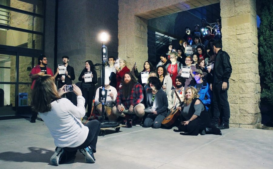 Suzanne Fagan, a full time theater instructor, takes a picture of the participants of the Ghostlight Project on Thursday. The light symbolizes the safe and inclusive nature of the theater department. Photo credit: Martin Bilbao
