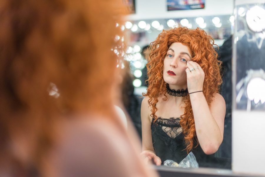 Cassidy von Kronemann, 22, prepares her makeup for the upcoming rehearsal.