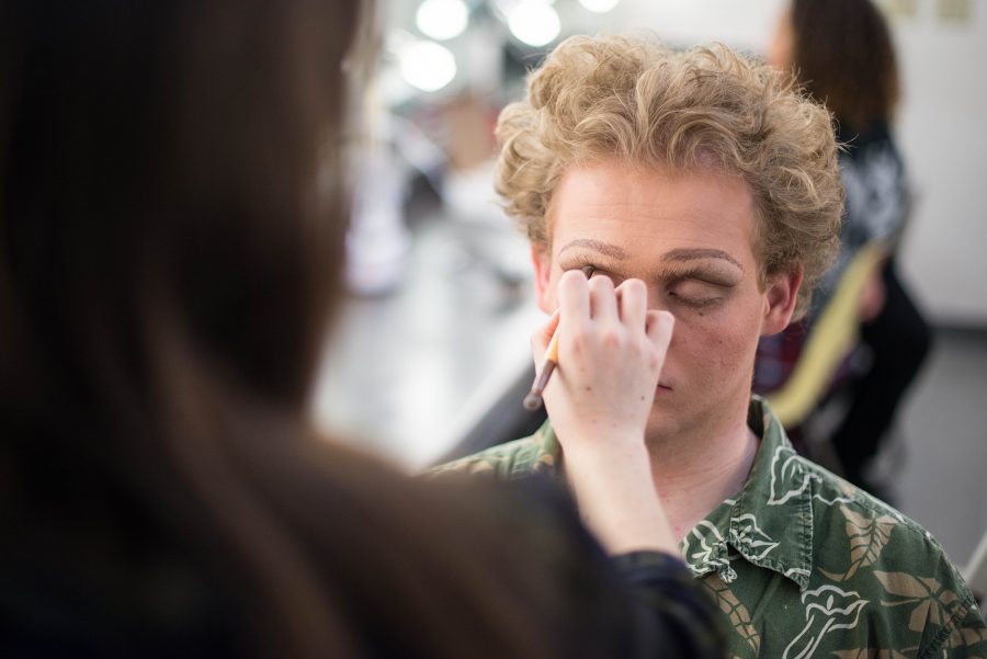 Brandon Larwence, Theater major, waits as his characters makeup is applied.