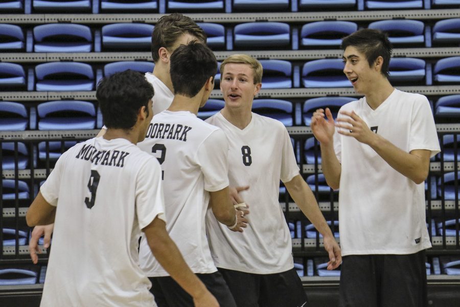 The Raiders congratulate each other after scoring a point against Santa Monica College. Photo credit: Krista Abrahamsen