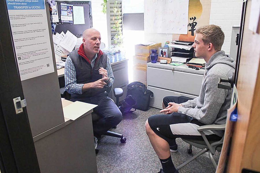 Donald Munshower, a member of Moorpark Colleges counseling staff, discusses with Cameron Cardy-Sterling, Journalism major. Photo credit: Chantal Miller