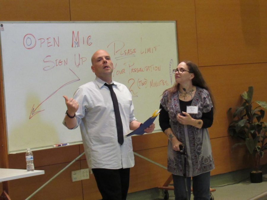Author-Instructor Brendan Constantine, left, and Meliza Banales announces the poem entries during the open mic segment of the Writers Festival. Photo credit: Mary Altshuller