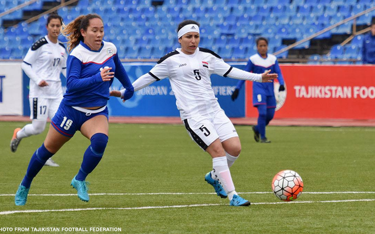 Eva Madarang faces off against a defender during a game against Iraq. Madarang began playing soccer when she was ten and it quickly became her favorite thing to do.