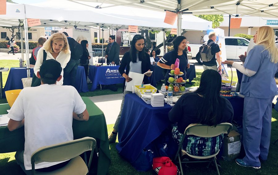Moorpark students and employers gather around a hut during Moorpark Colleges Job Fair, April 5, 2017, in Moorpark, Calif. Photo credit: Chantal Miller