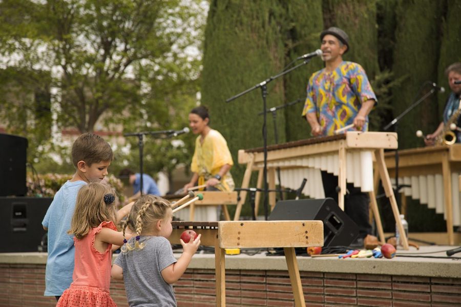 Local kids enjoy dancing and playing along with the band Masanga.  Masanga plays traditional and popular music from Africa and Latin America at Multicultural Day at Moorpark College, in Moorpark, Calif. on April 11, 2017. The ensemble is led by Dr. Ric Alviso, a Cal State Northridge ethnomusicologist, professor of World Music, and the director of the CSUN African Music Ensemble. Photo credit: Alicia Lick