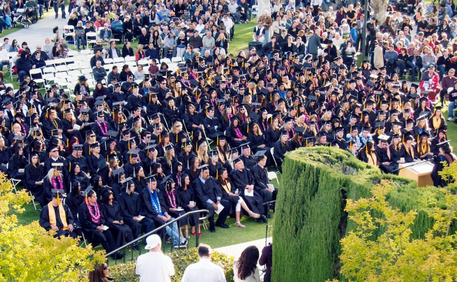 Students attend graduation in the campus quad on May 18, 2011. This year, graduation will be held on May 18 in the campus quad as well.