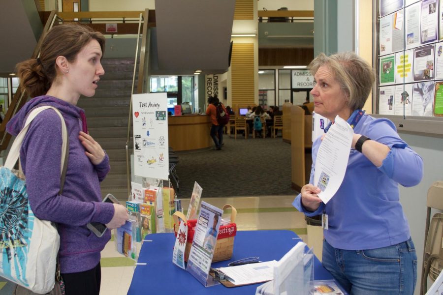 Health educator Allison Barton (right) talks to pre-nursing major Shannon Gordon, 25, (left) about how to combat test anxiety as part of the Student Health Centers Test Anxiety event. The event took place on April 25th and 26th in Fountain Hall and students had the chance to pick up a goodie bag and learn more about how to reduce testing anxiety. Photo credit: Karen Alvarez