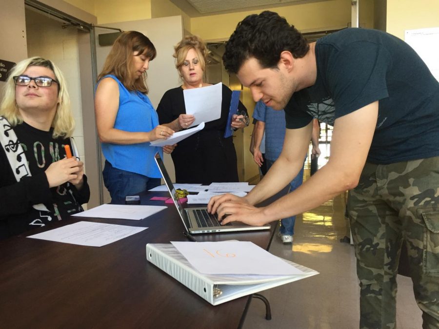 Taylor Anderson Right, Lisa Lion Left Center and Hovig Chobanian Left signing in for the one acts audition.