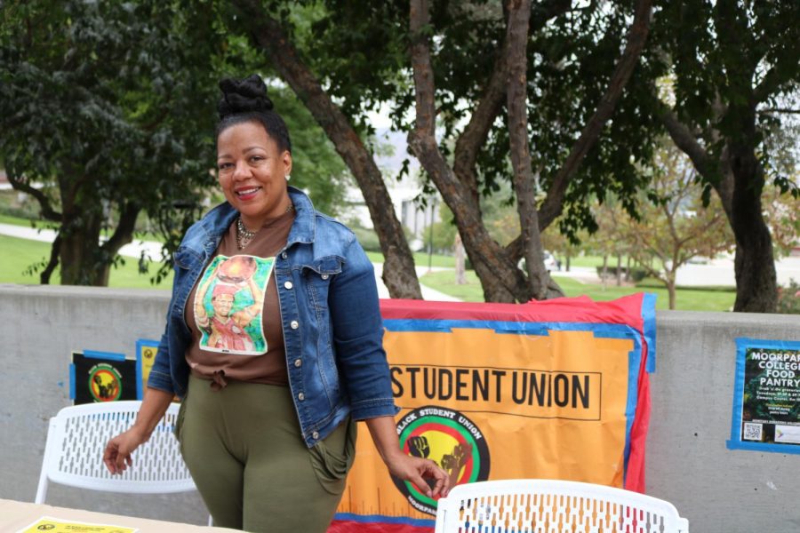 Jenyce Johnson, president of the Black Student Union stands at her booth on Raider Walk. Her club strives to promote values of inclusion and raise awareness for issues of diversity. 