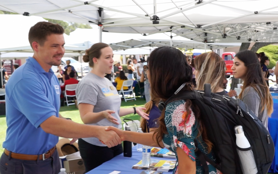 Students talk to representatives from UCLA at transfer day. UCLA was one of the more than 50 colleges and universities that were represented at the event. 