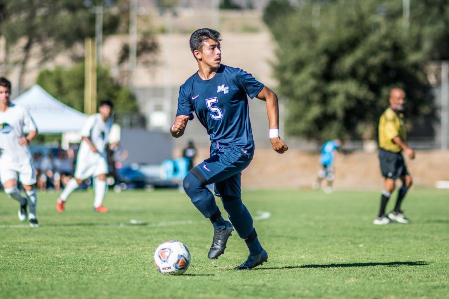 Left wing Alexis Jaimes dribbles the ball and looks to connect a pass with one of his teammates. The Raiders defeated Oxnard College 4-3 in a home game on Oct. 24, changing their overall record to 3-7-4. Photo credit: James Schaap