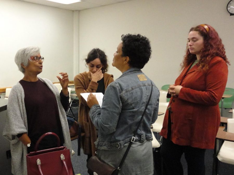 English professor, Sandra Hunter, left, provides feedback to poetry workshop members, Joelle Hannah, center, Nanor Abkarian, right, and Adriann Santer, far right, at their weekly meeting 
on November 2. Writers Workshop: everyone welcome is non-credit,  free, and takes place on Thursdays in HSS #222, at 4-5 p.m. Photo credit: Lisette Davies Ward