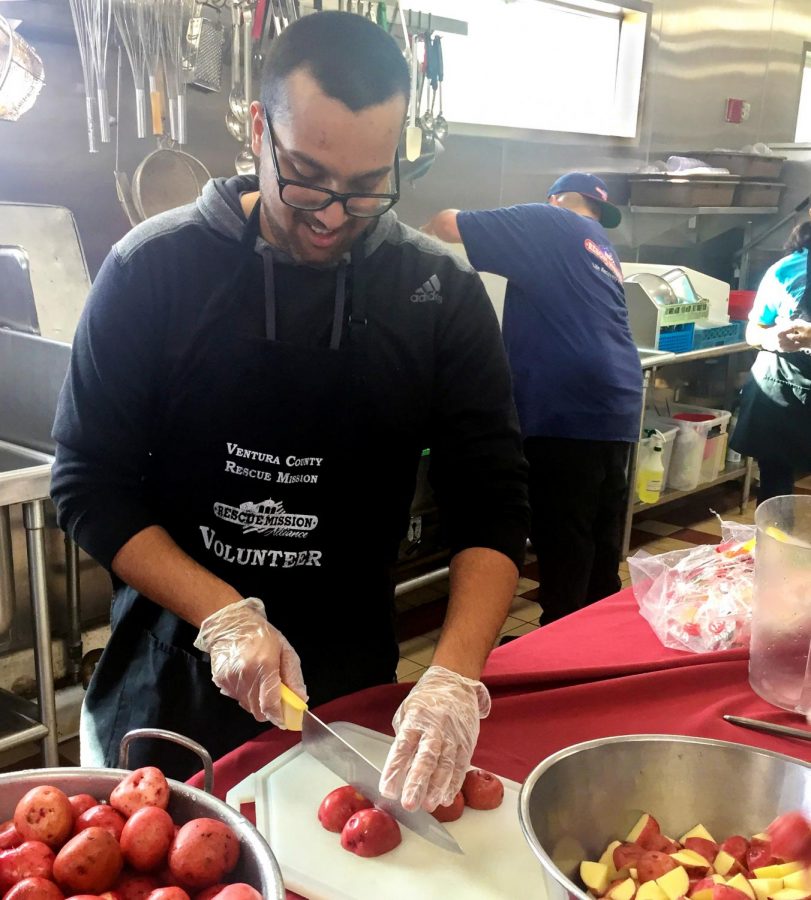 Muslim Students Association Vice President Yaser Khohar, 19, Bio Engineering major, chops potatoes at a soup kitchen. The students went to a soup kitchen on Nov. 11 to help prepare food for the needy.