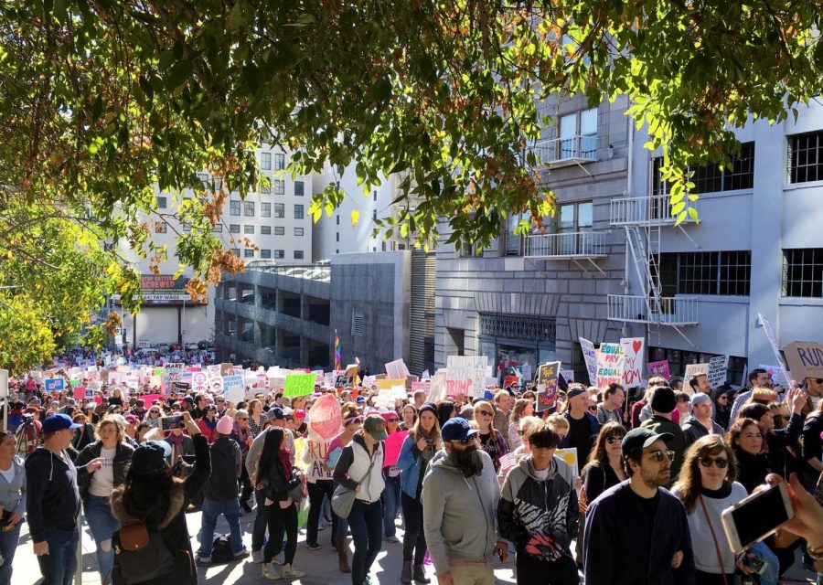Thousands of signs regarding voting, sexual assault, and equality are held up high by the attendees of the Womens March. Photo credit: Emily Consaga