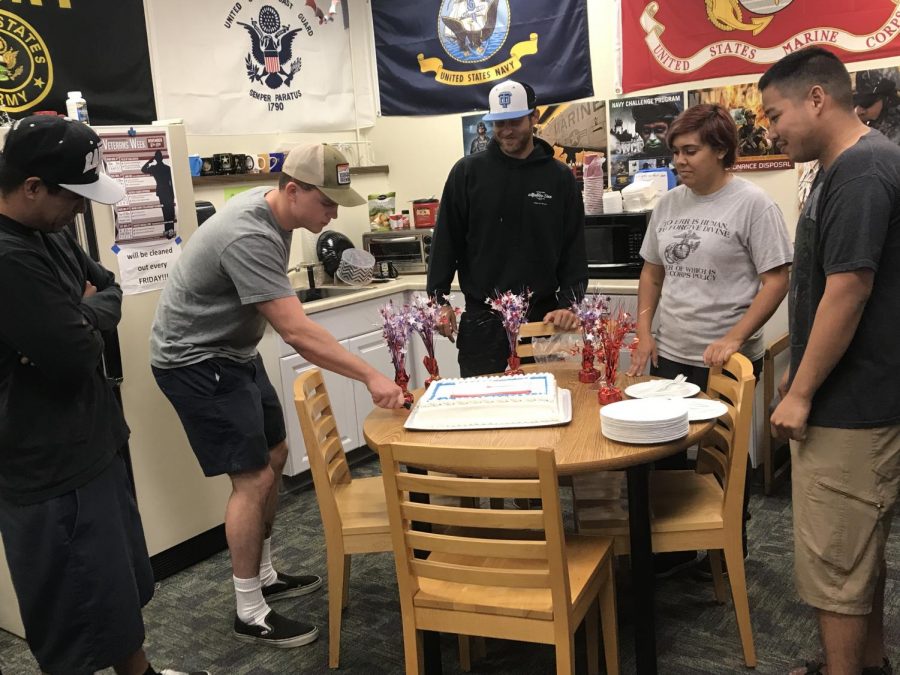 Veterans+from+all+branches+of+the+military+gather+to+cut+the+cake+for+the+Marine+Corps+242nd+Birthday.+Photo+credit%3A+Johnny+Conley