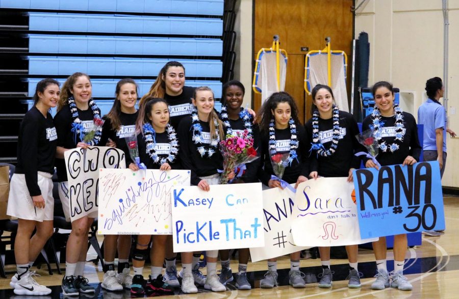 Womens+basketball+posing+for+pictures+with+all+of+their+sophomores.+Photo+credit%3A+Ryan+Ketcham