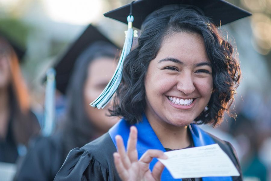 A student smiled during the spring 2017 graduation. There were over 400 students who participated in graduation that year. Photo credit: James Schaap
