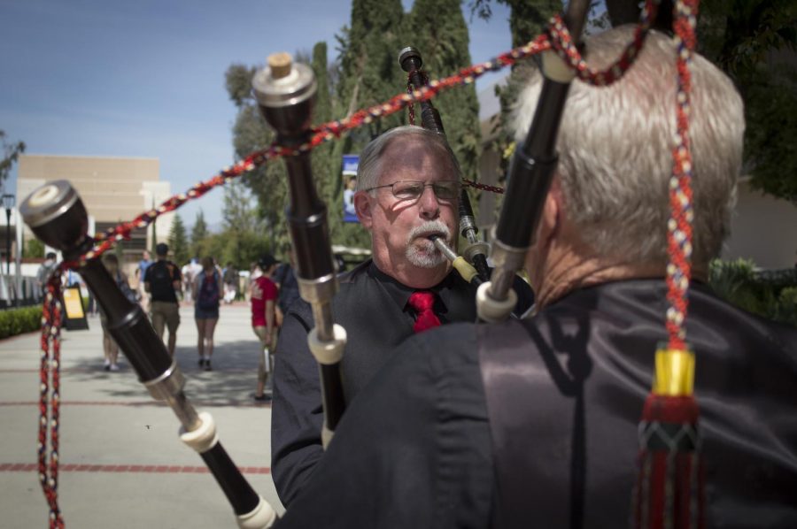 Bill Boetticher faces his bagpiping partener, Wally Boggess, as they play their music for the passersby during Multicultural Day at Moorpark College, on April 10, 2018, in Moorpark Calif. Both players represent their group, Gold Coast Pipes and Drums, and the diversity that is found in music from around the world. (©Evan Reinhardt 2018)