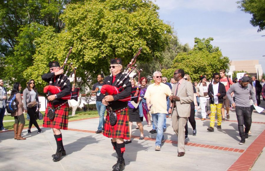 Moorpark Colleges Multicultural Day kicked off with a parade led by Scottish bagpipes, followed up by Bernardo Perez, left (in yellow shirt), Board of Trustee member, and Dr. Julius Sokenu (beige suit), Interim Executive Vice President for Moorpark College. April 11, 2017