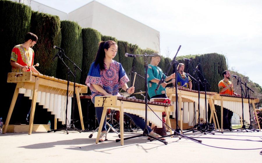 Joel Mankey (left), Risa Isogawa, Ric Alviso, Scott Murphy, and Alex Smith perform their traditional Zimbabwean music for the attendees of Multicultural Day on April 10, 2018. The band, Masanga Marimba, has been praticing and performing traditional African together since 2000. Photo credit: Evan Reinhardt
