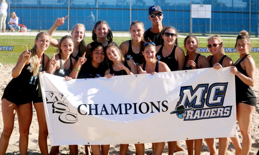 Moorpark College womens beach volleyball are posing with the famous MC Raiders banner after becoming Western State Conference champions. The Raiders defeated Ventura College 3-2 to win the title on April 20, 2018. Photo credit: Ryan Ketcham