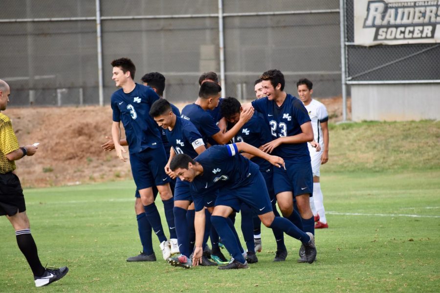 Moorpark Raiders celebrate with one another after Freshman forward, Javier Sanchez, ties the game with his freekick goal. Photo credit: Conrad De Santiago