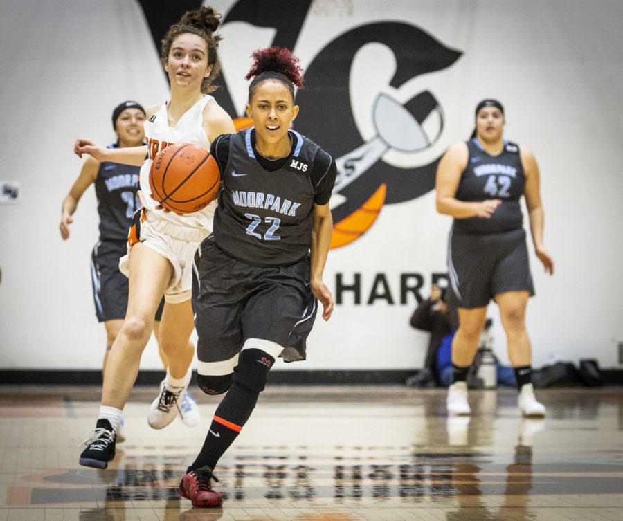 Freshman Breanna Calhoun speeds downcourt during Moorpark Colleges game against Ventura College on Friday, Feb. 22, in the Ventura College gym. Calhoun concluded the game with 23 points and 8 assists, helping her team claim the win. Photo credit: Evan Reinhardt