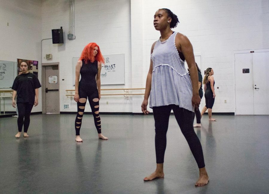 Shandria Blackmon, 27, stands ready to make the next move during Robert Salass modern dance class last week. The class practices their eerie dance piece, which the dancers call Voo-Doo. Photo credit: Margot Rowe